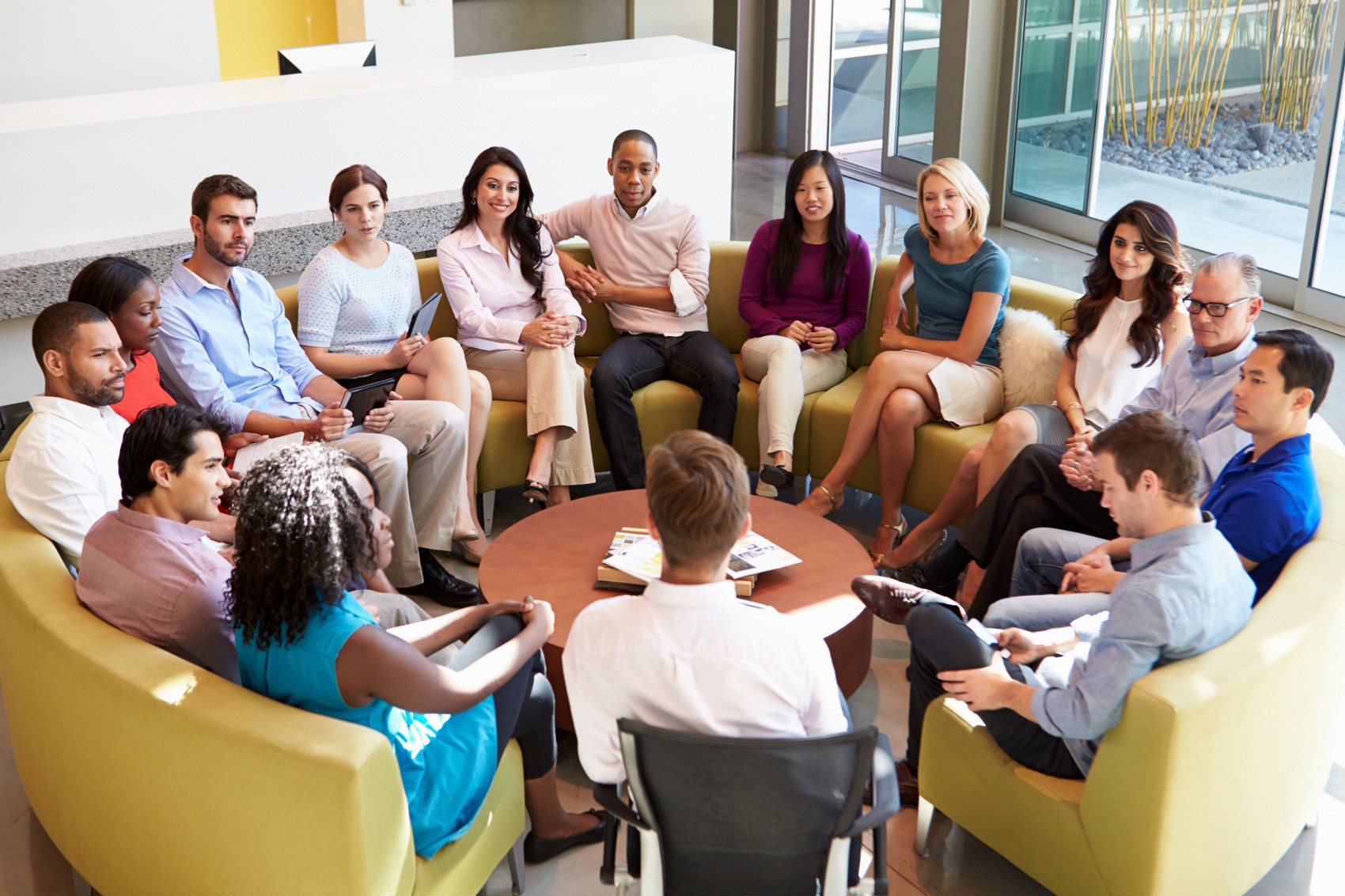 Adults taking part in a group discussion