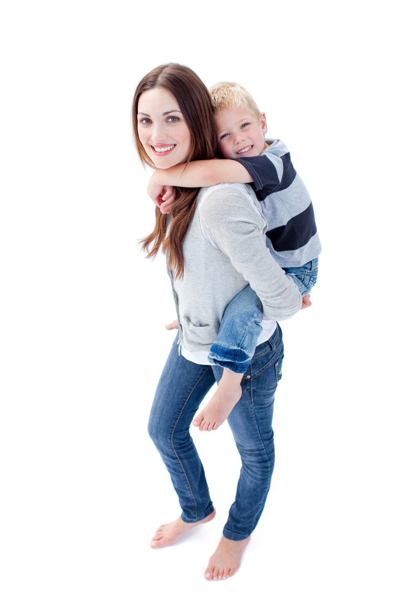 Mother carrying her smiling child on her back