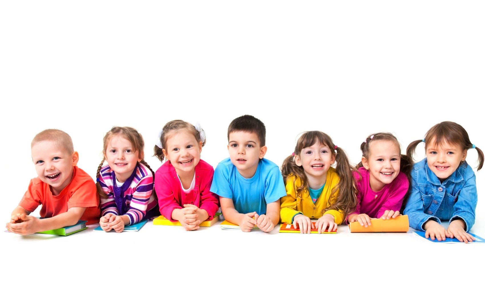 Children lying side by side and smiling