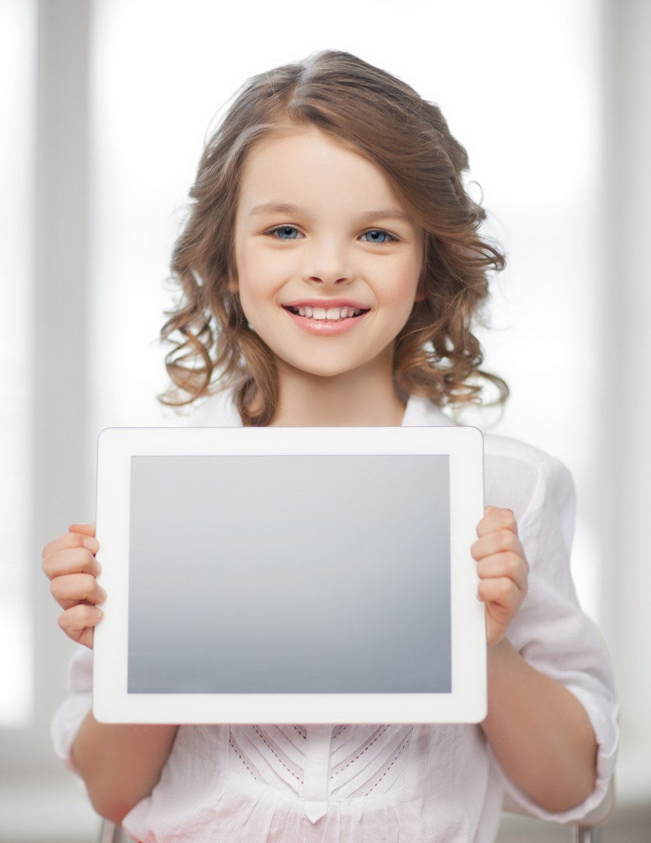 Child holding a tablet